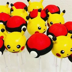 some red and yellow cake pops with black eyes