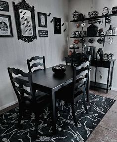 a black and white dining room with halloween decorations