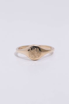 A classic hand engraved monogram ring. Solid 14k recycled gold. Signet face is 7.8mm round, and tapers to a 2.2mm band. 1-2 letters of your choosing engraved into the face. If you would like diamonds or other small birthstones inlaid into the ring, contact us here with the special request. This ring is made to order, please allow 3-4 weeks for delivery. Personalized Engraved 14k Gold Ring, Personalized Initial Ring In 14k Gold With Round Band, Personalized 14k Gold Initial Ring With Round Band, Minimalist 14k Gold Engraved Ring With Initials, Timeless 14k Gold Rings With Initials, Minimalist 14k Gold Ring With Engraving Option, Timeless Personalized 14k Gold Initial Ring, 14k Gold Jewelry With Initials On Round Band, Timeless Initial Ring With Engraving Option