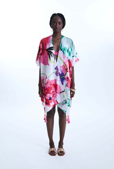 This James Lakeland kaftan is design in a hefty yet breathable fabrication, with a luxurious feel to it. Featuring an abstract water colour flower print, embellished with bouquets of tassels at each corners in the same colour tones.     Made in China 100% Polyester Machine Wash at 30°C, Do not bleach, Permanent Press, Iron at Low Temperature, Dry Clean any solvent except trichloroethylene, Do Not Tumble Dry. Spring V-neck Kaftan With Digital Print, White V-neck Floral Print Kaftan, Silk Floral Print Kaftan For Beach Cover-up, Spring Floral Print V-neck Kaftan, Multicolor Floral Print V-neck Kimono, Multicolor V-neck Kimono With Floral Print, Flowy Floral Print Kaftan With Short Sleeves, Spring Digital Print Kaftan, Flowy Short Sleeve Floral Print Kaftan