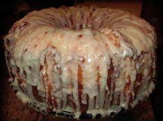 a bundt cake covered in icing sitting on top of a table