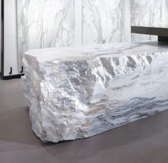 a large white marble counter top in a room