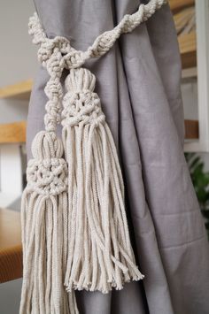 a curtain with tassels hanging from it