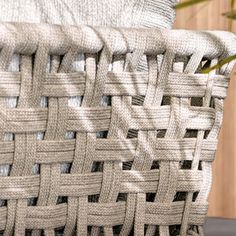 a close up of a woven chair cushion