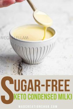 a hand holding a spoon over a bowl of sugar - free keto condensed milk