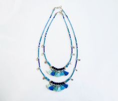 Spice up your Summer with unique tassel necklace in blue shades, with a carefree bohemian vibe. Made with Turquoise and Marble stones, navy blue ruberized beads, silver plated star charms, glass beads and tiny handmade cotton tassels. ►Pick between four lengths, wear two necklaces for a statement layered look or a single strand as an accent. ►Length Options: 18/20/25/27inches. Modeled necklaces are: Short necklace is 18 inches long (45cm). The longer necklace is 25 inches long (63cm). Message me Adjustable Blue Bohemian Tassel Necklace, Bohemian Beach Tassel Necklace With Fringe, Blue Hippie Necklaces For Festivals, Blue Hippie Necklace For Festivals, Hippie Blue Necklaces For Festivals, Blue Bohemian Beaded Necklaces With Tassels, Bohemian Blue Beaded Necklaces With Tassels, Adjustable Turquoise Tassel Necklaces, Handmade Blue Tassel Necklace As Gift