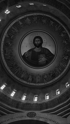 the inside of a church with a dome and paintings on it's walls,