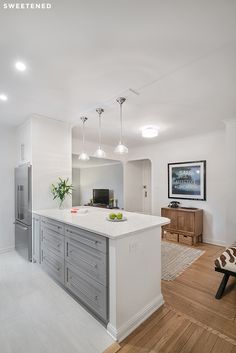 the kitchen is clean and ready to be used for cooking or dining, but it's not too far from the living room