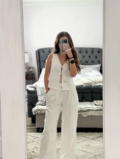 To shop this look click on the image.  A tie front linen vest top paired with linen pants makes a cute dressy summer outfit idea.  . . . . . . Summer outfits 2024 | summer outfit inspo | summer fits | linen pants outfit summer | summer tops | summer sandals | summer sets | linen pants outfit | linen pants set | white linen pants | linen trousers outfit | linen vest | cute tops | white vest top | vacation outfits | #summerstyle #ootd #outfitoftheday #outfits #vacationstyle #vacationoutfit Tie Front Vest Outfit, Linen Pants Summer Outfit, Linen Vest Outfit, Linen Pants Set, Vest Top Outfits, Linen Trousers Outfit, Linen Pants Outfit Summer, Pants Summer Outfit, Elegant Fits