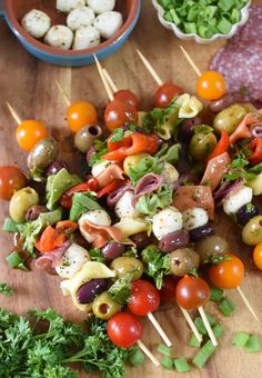 the skewers are filled with different types of vegetables and meats on toothpicks