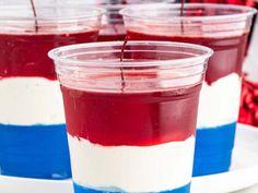 red, white and blue jello cups on a plate