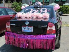 a car decorated with pink and purple decorations