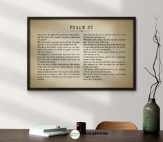 an old bible verse framed in a wooden frame on a wall next to a vase with flowers