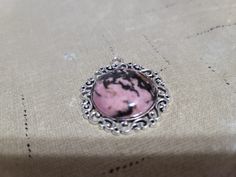 "Rhodonite in a silvertone filigree pendant.  25mm round cabochon. Comes with a silvertone snake chain available in 18\", 20\" and 24\" lengths.  Please specify when ordering." Filigree Pendant, Snake Chain, Pendant Necklaces, Jewelry Necklace Pendant, Silver Tone, Jewelry Necklaces, Necklaces, Ships, Pendant Necklace