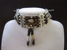 "Bone chokers are part of the Native American culture in almost every part of World. Worn as ornamentation and for protection. Wearing or carrying animal parts dates back more than 15,000 years and was believed to endow the wearer with the power of the creature. This choker has 4 rows of hairpipe beads carved from Buffalo Bone. The choker measures 14\" long with 9\" of leather tie's on both sides. Choker is packaged inside Organza Bag for storing or gift giving. Inside the bag is an Information Southwestern Style Adjustable Choker Jewelry, Southwestern Adjustable Choker Jewelry, Adjustable Southwestern Style Choker Jewelry, Southwestern Style Choker Jewelry Gift, Southwestern Adjustable Choker As Gift, Adjustable Bohemian Necklaces For Collectors, 1911 Leather Holster, Bone Choker, Native Necklace