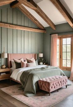 a bedroom with green walls, pink bedding and wooden beams on the ceiling is shown