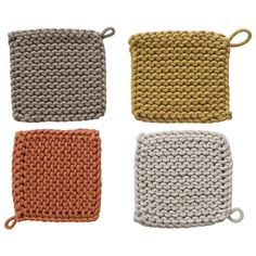 four crocheted dishcloths are shown in three different colors and one is brown