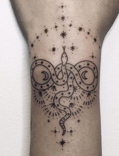 a woman's arm with a tattoo design on the left side of her body