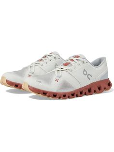 the on cloud running shoe in white and red is available for men's or women's