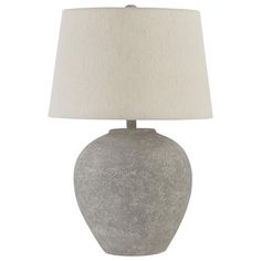 a gray table lamp with a white shade