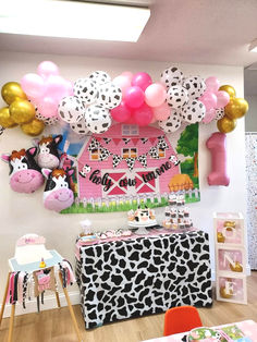 a room filled with balloons and farm animals