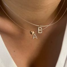 "Personalized Invisible Cord Necklace, Initial Clear Cord, Dainty Name necklace, Gift for Girlfriend, Minimal Layering Necklace, Zirconia Gemstone Letter Necklace, Trendy Girlfriend Necklace, Nylon Cord, Tiny Letter, 925, Trendy 925 Sterling Silver Jewelry Pure 925 Sterling Silver Gold & Rose Gold & Rhodium Plated Cz Stone / Zirconia Gemstone Block Letter Hypoallergenic, Nickel-free This Product Requires 1-2 weeks to be Produced 16\" Clear Cord Chain - Send me a message if you need different len Valentine's Day Clear Jewelry For Party, Clear Pendant Necklaces For Anniversary, Clear Heart Charm Necklace With Heart Pendant, Clear Heart Pendant Jewelry For Valentine's Day, Elegant Heart-shaped Clear Necklace, Elegant Clear Heart-shaped Necklace, Elegant Clear Heart Shaped Necklace, Clear Heart Charm Necklace, Elegant Clear Necklaces For Valentine's Day