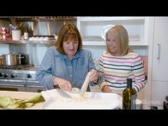 two women are in the kitchen preparing food