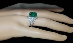 Gorgeous Vintage Diamond & Emerald in Platinum ring circ 1920's center set natural Colombia emerald weight 4.43ct size 11.1x9.3mm GIA cert. Has a nice rich green color ,brilliant clean very lively stones. Side Set two Natural old mine cut Diamonds Weight 0.50ct. Size 4mm SI1 -G lively brilliant, clean white bright stones. Side set small diamonds weight 0.25ct. Ring size 7.5 Resizable This tremendous old vintage ring is in a very good condition. Retail value $18,500 net. Appraisal available Art Deco Collectible Emerald Ring, Art Deco Filigree, Green Emerald Ring, Filigree Engagement Ring, Emerald Diamond Ring, White Gold Engagement Ring, Sparkling Rings, 18k Gold Ring, White Gold Engagement