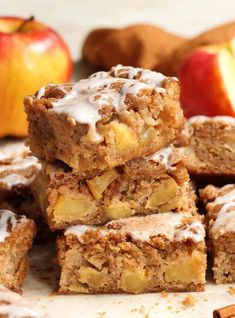 a pile of apple pie bars sitting on top of a cutting board