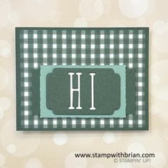 a green and white checkered card with the letter h in it's center