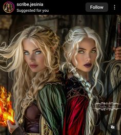 two beautiful women dressed in medieval clothing holding torches and looking at the camera while standing next to each other