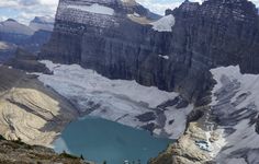 the mountains are covered in snow and blue water, while there is no image on it