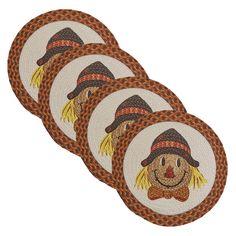 four woven coasters with scarecrow faces on them