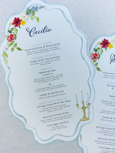 the wedding menu is decorated with flowers and candles