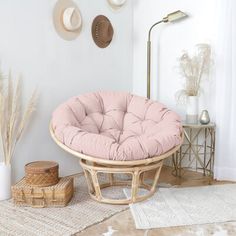 a round chair sitting on top of a rug in a living room