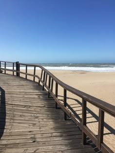 a wooden walkway leading to the beach