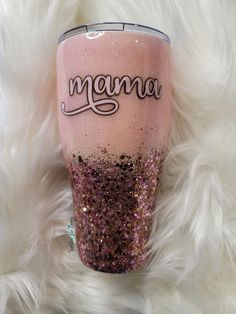 a pink and purple glitter tumbler with the word nenna written in cursive writing