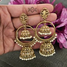 "Gorgeous, handcrafted gold & pearls polki jhumka baali! The earrings are 3.25 \" long & 1.75 \" wide. Picture is taken in natural room light. Please contact if you have any questions. Thanks! Color, shades, texture displayed may slightly vary from the actual product due to digital image limitations. We request you to consider these minor variations. Please expect the possibility of some slight imperfections when buying hand made jewelry. If you have any questions, please contact us." Gold Kundan Jhumkas For Festivals, Wedding Brass Chandbalis With Tilla Detailing, Wedding Chandbalis In Brass With Tilla Detail, Wedding Brass Chandbalis With Tilla, Wedding Bollywood Style Brass Chandbalis, Wedding Chandbalis With Tilla In Brass, Wedding Brass Chandbalis For Diwali, Wedding Bollywood Style Chandbalis In Brass, Wedding Bollywood Chandbalis In Brass