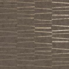 an area rug with lines on it in brown and beige colors, made up of several different shades of grey