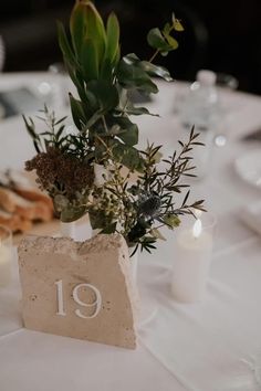 the table is set with candles and flowers