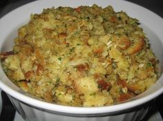 a white bowl filled with food on top of a stove