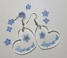 Forget-me-not earrings feature tiny, intricate blue flowers that symbolize true and undying love or remembrance  these earrings offer a touch of charm and elegance, perfect for adding a subtle and natural element to any outfit. Blue Flower Earrings For Mother's Day, Personalized Blue Earrings For Gift, Mother's Day Blue Flower Earrings, Blue Dangle Earrings For Mother's Day, Blue Hypoallergenic Earrings For Mother's Day, Undying Love, Natural Element, Forget Me Not, Blue Flowers