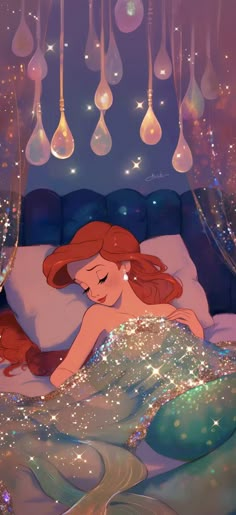 the little mermaid is laying in her bed with bubbles hanging from it's ceiling