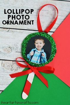 an ornament hanging from a christmas tree with the words lollipop photo ornament on it