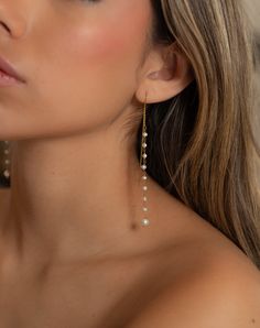 Simplicity! These the fresh water pearl earrings make a fashionable statement. The long and sexy look is striking. Dangle Pearl Earrings For Party, Elegant Teardrop Pearl Earrings With Dangling Beads, Chic Pearl Drop Chandelier Earrings For Party, Chic Dangle Pearl Earrings For Party, Elegant Chandelier Earrings With Dangling Beads For Evening, Elegant Evening Chandelier Earrings With Dangling Beads, Long Drop Pearl Earrings For Pierced Ears, Long Drop Pearl Chandelier Earrings For Party, Bridal Pearl Chain Drop Earrings