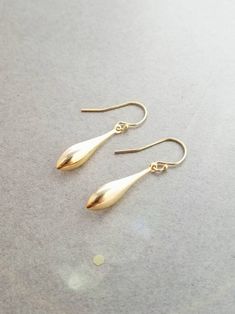 "These earrings are simple and perfect for everyday wear. Long 14k gold filled teardrops hang from your choice of ear wires. Teardrops are concave on the backside. Total length is 1 1/2\" on leverbacks (slightly shorter of french wires) Items will arrive safely packaged on an earring card in an air tight bag, and with an organza bag, ready for gift giving. If you would like a gift box instead, please let me know. Please let me know if you have any questions!" Nickel-free 14k Gold Filled Teardrop Earrings, 14k Gold Filled Elegant Teardrop Earrings, Gold Long Drop Teardrop Earrings For Everyday, Minimalist Gold Teardrop Pendant Earrings, Minimalist 14k Gold Filled Teardrop Dangle Earrings, Everyday Gold Long Drop Teardrop Earrings, Elegant 14k Gold-filled Teardrop Earrings, Everyday Long Drop Gold Teardrop Earrings, Minimalist Gold Teardrop Earrings