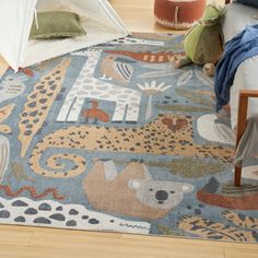 a child's room with a bed, rug and stuffed animals on the floor