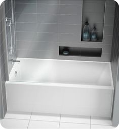 a white bath tub sitting inside of a bathroom