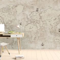 an office area with a desk, chair and large map on the wall