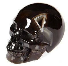 a black skull with a triangle on it's face is shown against a white background